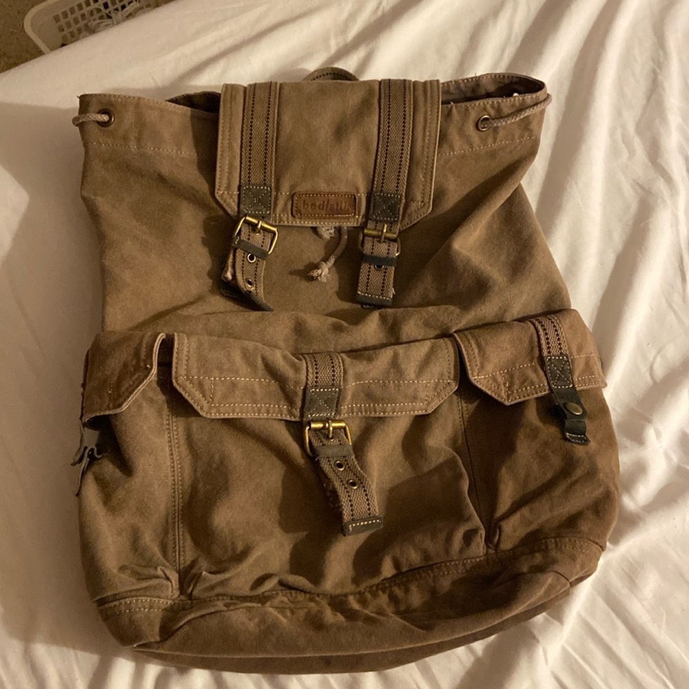 Bedstu Brown Canvas backpack with several pockets
